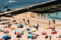 High perspective view of many people at Pescadores Beach sunbathing during the summer