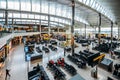 High perspective view of passengers and shops at departure terminal at Heathrow Terminal 3 in London, UK