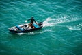 High perspective view of smiling fisherman showing off his catch in Ilheus, Brazil