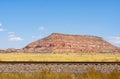 High plains and imposing mesa under blue sky Royalty Free Stock Photo