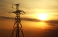High power electric line towers at dramatic sunset Royalty Free Stock Photo
