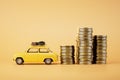 High price to buy a car. stacks of coins and a car on a pastel background. 3D render Royalty Free Stock Photo