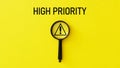 High priority is shown using a text. Priorities and business important planning urgency concept Royalty Free Stock Photo