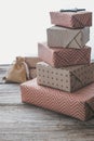 High pyramid of gift Christmas boxes and sustainable pouch bag. Ecological Christmas holiday concept, eco decor Royalty Free Stock Photo