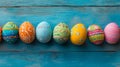 Colorful Decorated Easter Eggs on Blue Wooden Background - Spring Holiday Concept Royalty Free Stock Photo