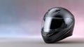 High-quality black motorcycle helmet displayed in a soft gradient background Royalty Free Stock Photo