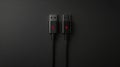 High-Quality Black USB Cable With Red Accent on Dark Background for Charging and Data Transfer Royalty Free Stock Photo