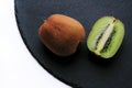 Fresh kiwis and black shale Royalty Free Stock Photo