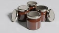 Four Glass Jars of Chocolate Hazelnut Spread Mockup with Metallic Lids Royalty Free Stock Photo