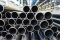 High quality Galvanized steel pipe or Aluminum and chrome stainless pipes in stack waiting for shipment in warehouse Royalty Free Stock Photo