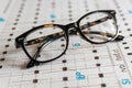 High quality image of glasses on a snellen eye chart for precise vision testing examination Royalty Free Stock Photo