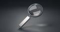 A magnifying glass with a sleek handle on a dark background Royalty Free Stock Photo