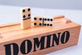 High quality photography. Close up to domino pieces on the game box. Two domino pieces on a white isolated background Royalty Free Stock Photo