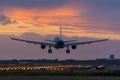 High quality picture of a plane landing before sunrise. Royalty Free Stock Photo