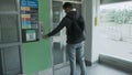 High quality picture of a young man who is waiting for elevator on the parking lot or station. Royalty Free Stock Photo