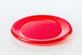 High quality red frisbee isolated on a clean white background with sharp details and realistic lighting Royalty Free Stock Photo