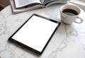 Sleek Tablet on Marble Countertop with Coffee Cup and Magazines, Clean Professional Workspace