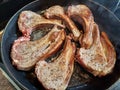 High quality top and lamp chops cooked in an ironcast pan Royalty Free Stock Photo