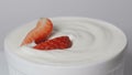 High quality video of strawberries falling into milk in real 1080p slow motion