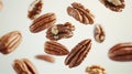 High-quality view of assorted nuts including almonds, walnuts, and pecans floating on white background Royalty Free Stock Photo