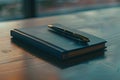 Business Notebook and Pen on Wooden Table Royalty Free Stock Photo