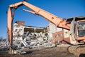 High Reach Excavator machines for demolition of tall building. Machine with hydraulic shears for demolish Royalty Free Stock Photo