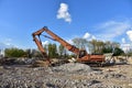 High Reach Excavator machines for demolition of tall building. Machine with hydraulic shears for demolish. Hydraulic Crushing Royalty Free Stock Photo