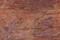 High res dark intense gradient old weathered rich brown multi earth tone uneven textured stone wall texture Royalty Free Stock Photo