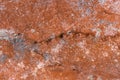 High res dark orange rough and weathered stone with white patches