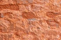 high res Intense rough and grunge pale salmon pink shaded stone wall texture background close up