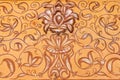 High res natural bright pale sandstone wall inlaid and painted with intricate floral and geometric arabesque relief decorations