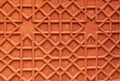 High res natural bright vibrant red sandstone door inlaid with intricate floral and geometric relief decorative panel