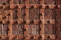 high res of old grunge and weathered pale reddish brown wood traditional studded door texture close up background Royalty Free Stock Photo