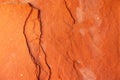 High res old vibrant gradient rich orange earth tone rough sandstone wall with darker cracks, texture background Royalty Free Stock Photo