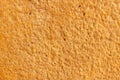 High res old vibrant rich yellow and orange tone rough stone wall, texture background close up Royalty Free Stock Photo