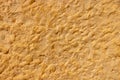 High res pale gradient old rich traditional sandy brown sandstone rough stone wall, texture background Royalty Free Stock Photo