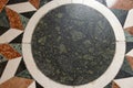 high res pale white with geometrical patterns and a green circle in the center decorative marble stone Royalty Free Stock Photo