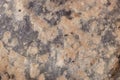 high res semi smooth dark gray natural stone texture close up background with bright pale pink spots Royalty Free Stock Photo