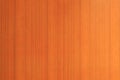 This high-resolution background texture captures the detailed grain of a vertical orange-stained wood surface, ideal for modern Royalty Free Stock Photo