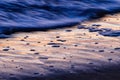 a close up of the edge of a sand covered beach Royalty Free Stock Photo