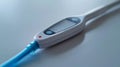 A high-resolution close-up of a digital thermometer displaying a normal body temperature, with a clean and minimalist design