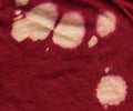 Cotton Fabric Texture - Red with Bleach Stains Royalty Free Stock Photo