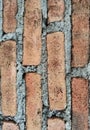 High resolution close up of rustic brick wall texture with rough cement surface. Royalty Free Stock Photo