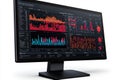 Computer monitor with dark mode dashboard displaying complex data visualizations and analytics Royalty Free Stock Photo
