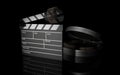 3D render of film clapperboard with reel Royalty Free Stock Photo