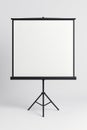 Blank Roll-Up Projector Screen on Tripod Stand Mockup in Minimalist Studio Royalty Free Stock Photo