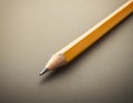 Sharp Yellow Pencil with Freshly Sharpened Tip on Smooth Surface Royalty Free Stock Photo