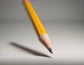 Sharp Yellow Pencil with Freshly Sharpened Tip on Smooth Surface Royalty Free Stock Photo