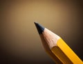 Sharp Yellow Pencil with Freshly Sharpened Tip on Smooth Surface Royalty Free Stock Photo