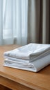 A stunning image of freshly washed white cotton bed sheets neatly folded. Clean surface in room. Bedding set Royalty Free Stock Photo